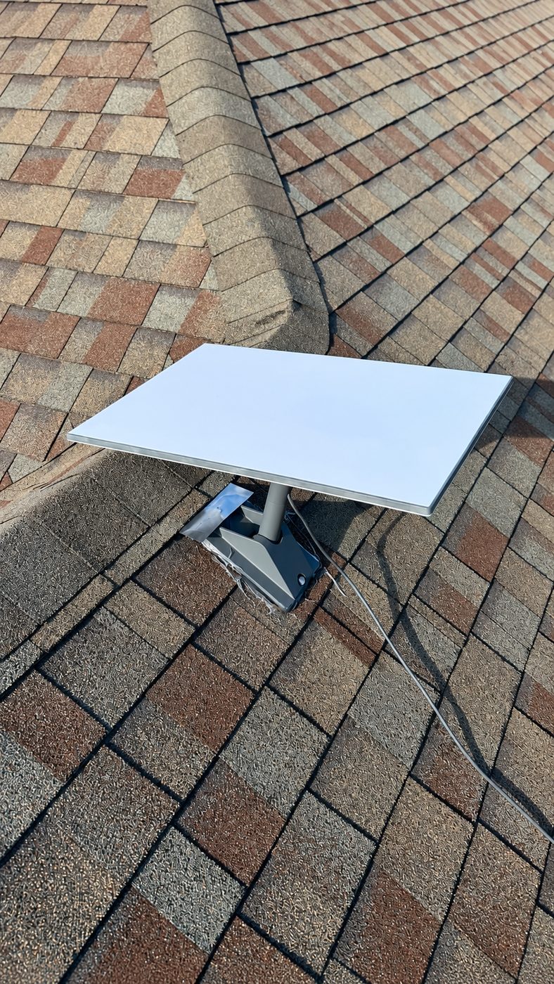 Non-penetrating mount sitting on composition shingle, no holes through the deck